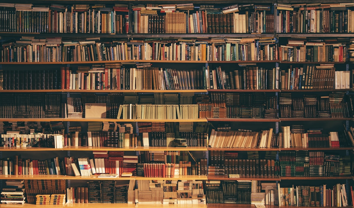 Reference volumes on a shelf beside contract files